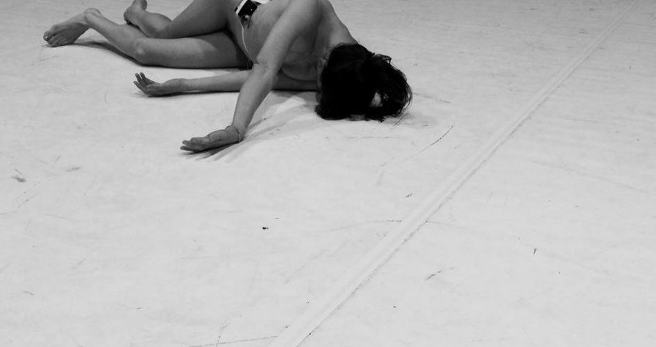 Dancer lying on floor at Dance House